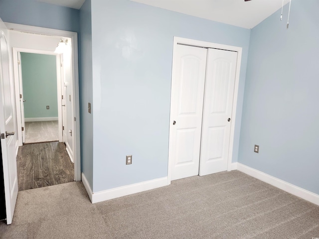 unfurnished bedroom featuring a closet and carpet