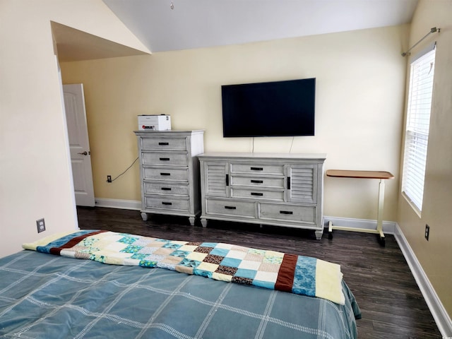 unfurnished bedroom with dark hardwood / wood-style flooring and vaulted ceiling