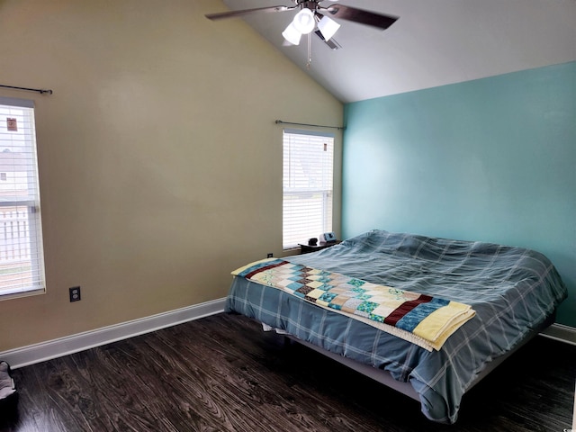 bedroom featuring ceiling fan, lofted ceiling, dark hardwood / wood-style flooring, and multiple windows