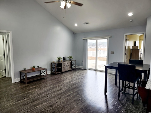 dining space featuring ceiling fan, high vaulted ceiling, and dark hardwood / wood-style flooring