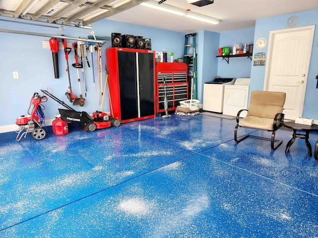 garage featuring washing machine and dryer