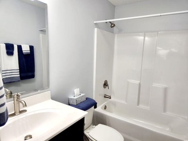 full bathroom featuring vanity, bathing tub / shower combination, and toilet