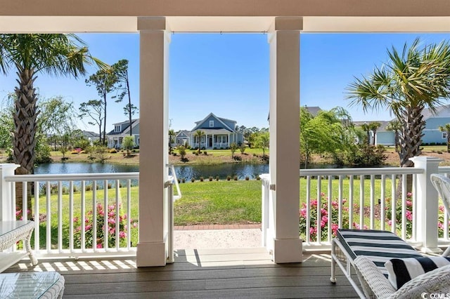 doorway to outside featuring dark hardwood / wood-style floors and a water view