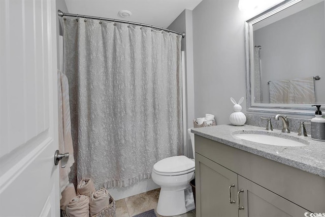 bathroom with vanity, tile patterned floors, and toilet