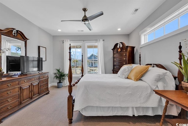 bedroom featuring ceiling fan and light colored carpet