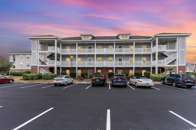 view of outdoor building at dusk