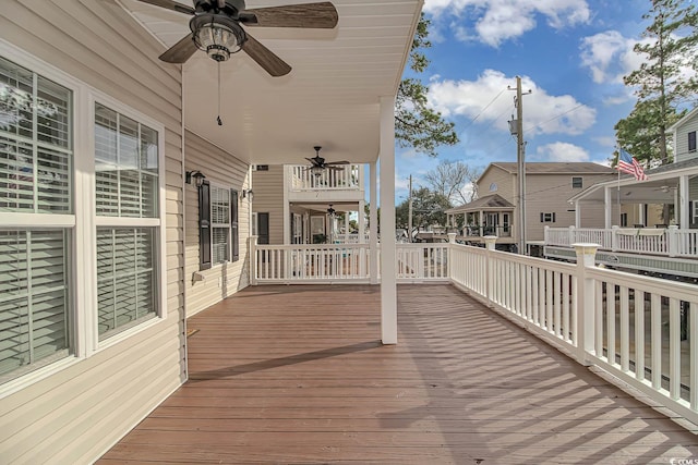 wooden terrace featuring ceiling fan