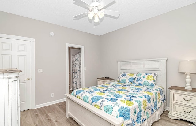 bedroom featuring a textured ceiling, baseboards, a ceiling fan, and light wood-style floors