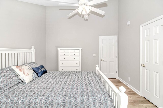 6001-1383 S Kings Hwy, Myrtle Beach, SC 29575 - bedroom with light wood-style floors, a ceiling fan, and a towering ceiling