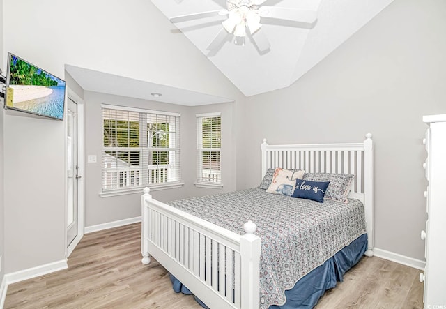 bedroom featuring lofted ceiling, ceiling fan, baseboards, and wood finished floors