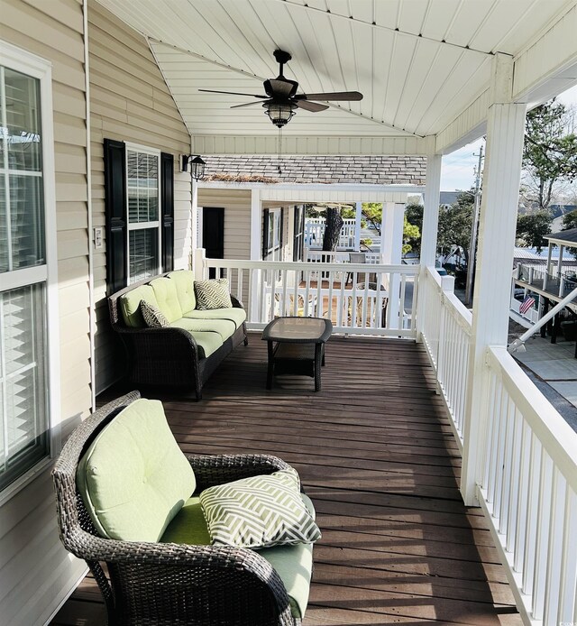 6001-1383 S Kings Hwy, Myrtle Beach, SC 29575 - wooden deck featuring an outdoor living space and a ceiling fan