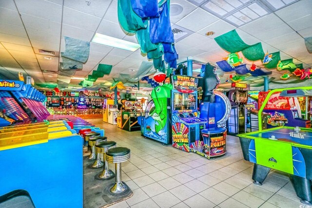 6001-1383 S Kings Hwy, Myrtle Beach, SC 29575 - playroom with tile patterned floors, visible vents, and a paneled ceiling