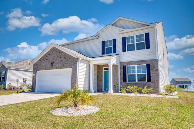 traditional-style home with a front yard, an attached garage, brick siding, and concrete driveway