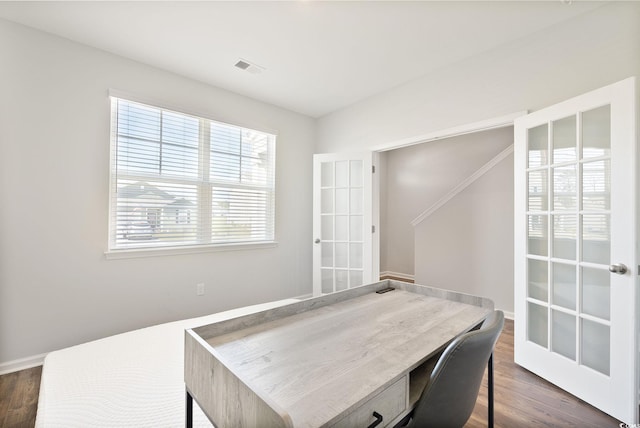 home office featuring dark wood finished floors, visible vents, french doors, and baseboards