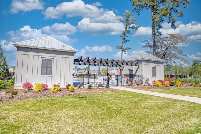 exterior space with a pergola and fence