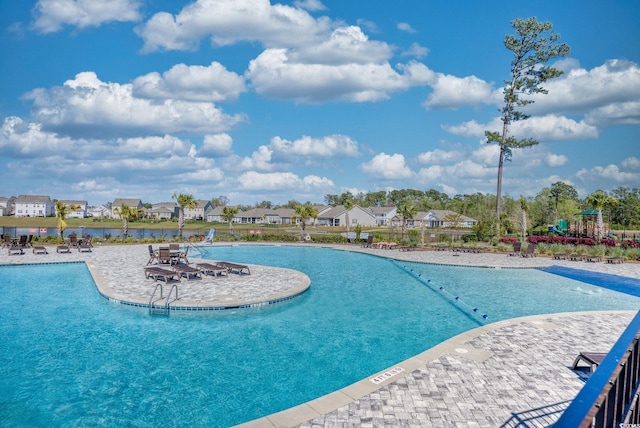 community pool featuring a patio area