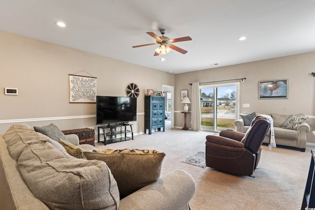 living area featuring recessed lighting, ceiling fan, baseboards, and carpet