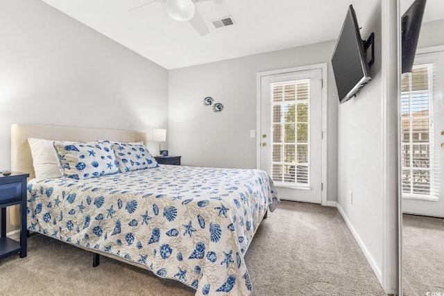 carpeted bedroom featuring access to exterior and ceiling fan