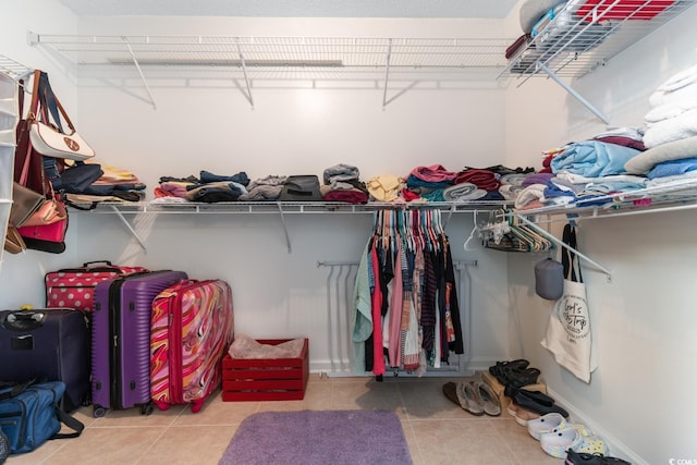 spacious closet featuring tile patterned floors