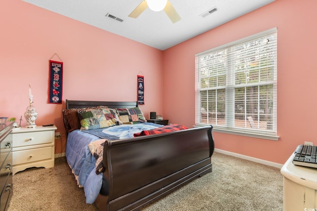 bedroom featuring ceiling fan and light carpet