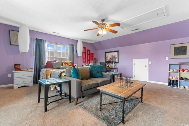 living room with ceiling fan, lofted ceiling, and carpet