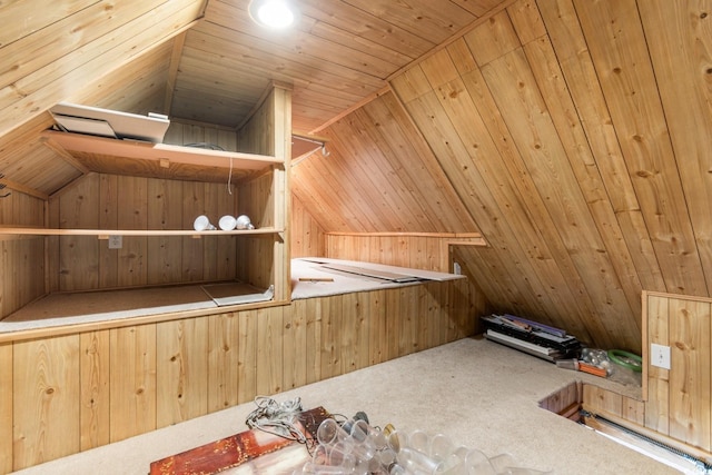 bonus room with carpet floors, wooden walls, and wooden ceiling