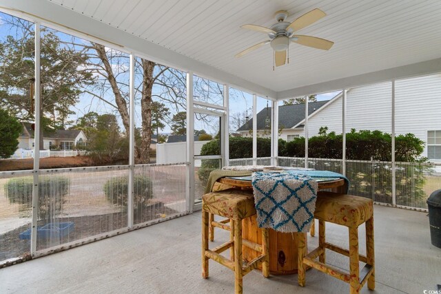 sunroom / solarium with ceiling fan