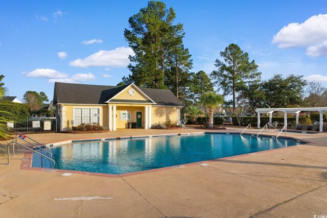 view of pool featuring a patio and a pergola