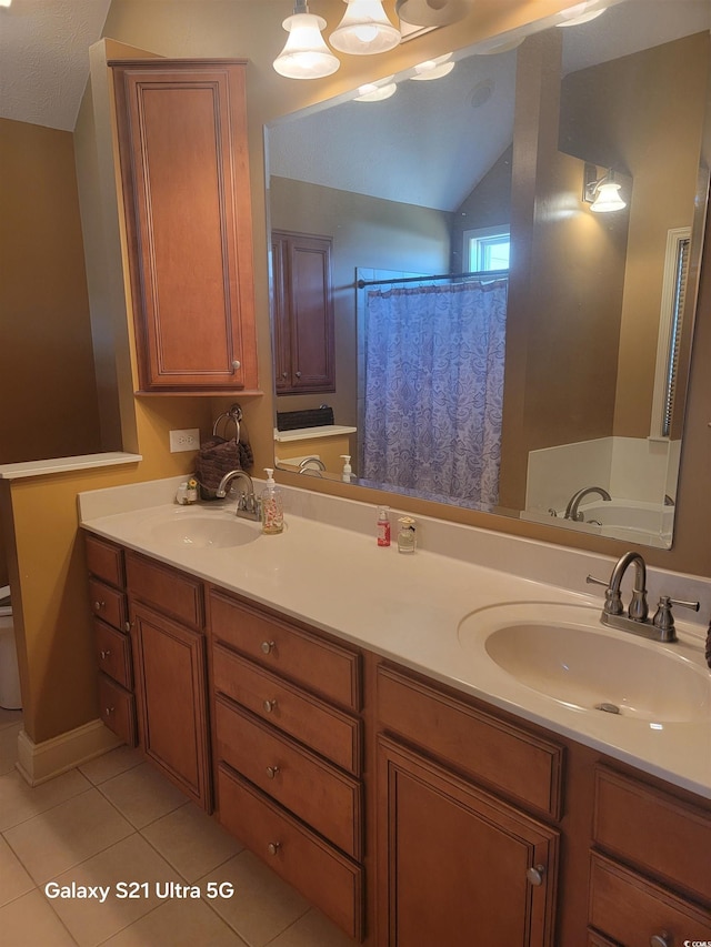 full bath featuring tile patterned floors, lofted ceiling, double vanity, toilet, and a shower with curtain