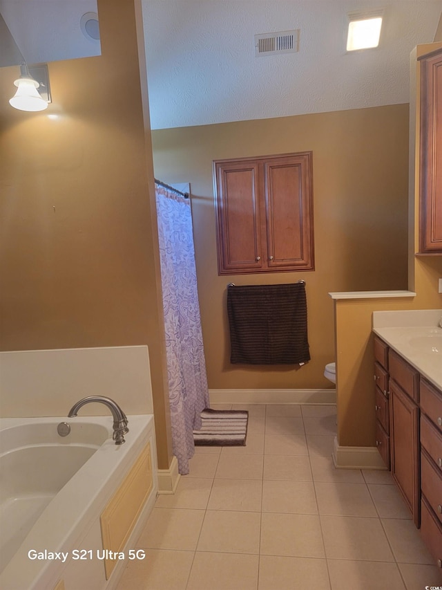 full bath featuring tile patterned floors, visible vents, toilet, vanity, and a bath