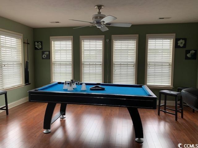 game room featuring pool table, wood finished floors, a ceiling fan, visible vents, and baseboards