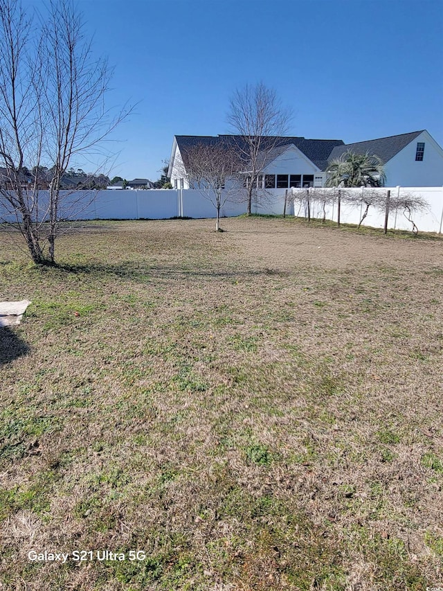 view of yard with fence