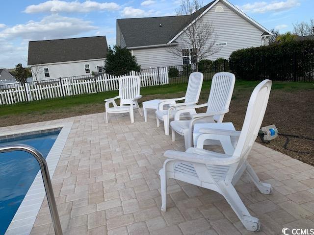 view of patio / terrace featuring a fenced in pool and fence private yard