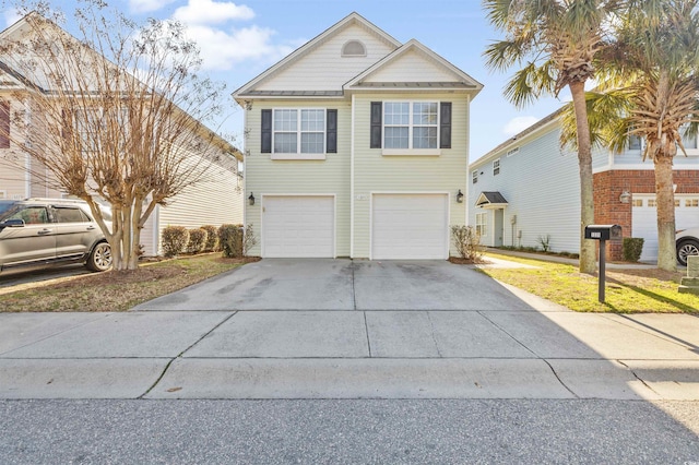 view of front of property featuring driveway and an attached garage