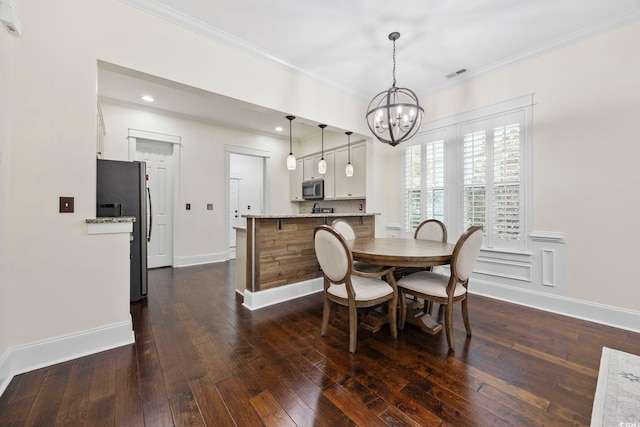 1188 Peterson St, Myrtle Beach, SC 29577 - dining room featuring a chandelier, crown molding, dark wood-style floors, baseboards, and recessed lighting