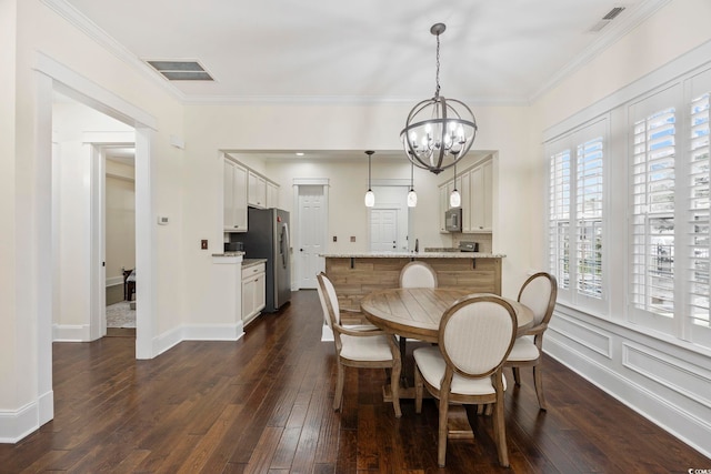 1188 Peterson St, Myrtle Beach, SC 29577 - dining room featuring a chandelier, dark wood-type flooring, and crown molding