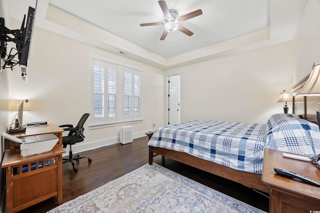 1188 Peterson St, Myrtle Beach, SC 29577 - bedroom with wood finished floors, baseboards, a tray ceiling, and an office area