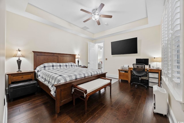 1188 Peterson St, Myrtle Beach, SC 29577 - bedroom with a tray ceiling, an office area, dark wood-style flooring, and baseboards