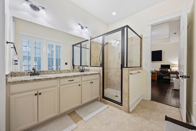 1188 Peterson St, Myrtle Beach, SC 29577 - bathroom featuring a shower stall, double vanity, tile patterned floors, baseboards, and ensuite bathroom