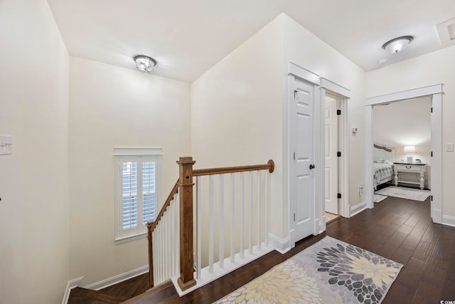 1188 Peterson St, Myrtle Beach, SC 29577 - hallway with an upstairs landing, wood finished floors, and baseboards