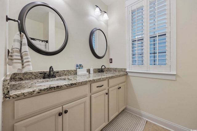 1188 Peterson St, Myrtle Beach, SC 29577 - bathroom featuring baseboards, double vanity, and tile patterned floors