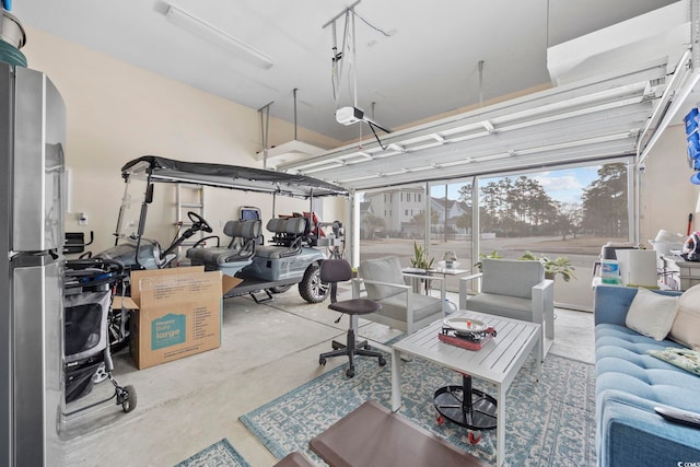 1188 Peterson St, Myrtle Beach, SC 29577 - garage with freestanding refrigerator and a garage door opener
