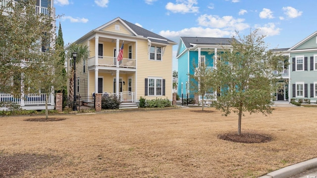 1188 Peterson St, Myrtle Beach, SC 29577 - view of front of property with a balcony, covered porch, and a front lawn