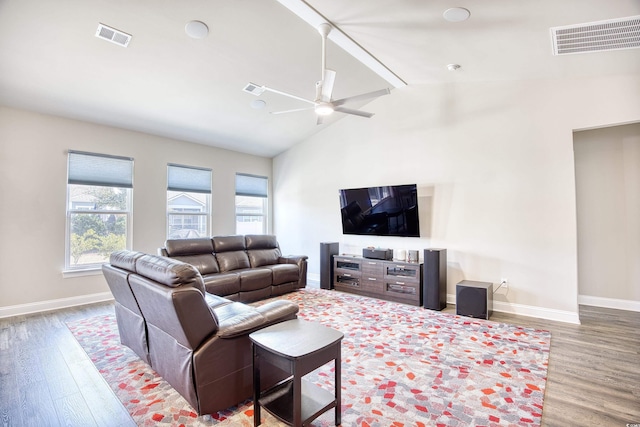 living room featuring lofted ceiling, wood-type flooring, and ceiling fan