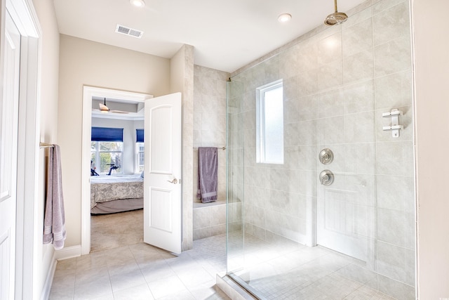 bathroom with tile patterned floors and a shower with door