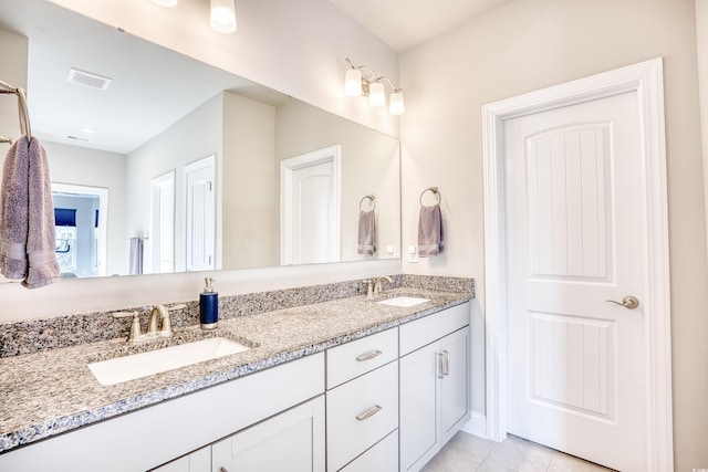 bathroom featuring tile patterned floors and vanity