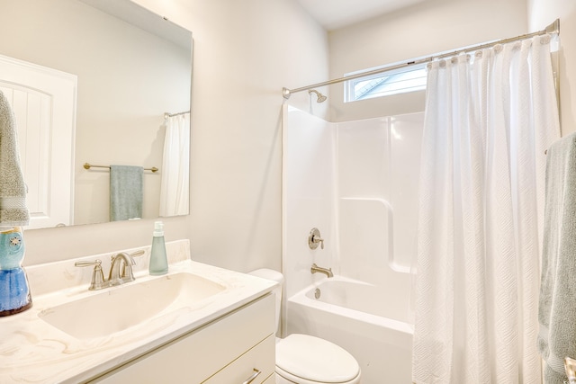 full bathroom with shower / bath combo, vanity, and toilet