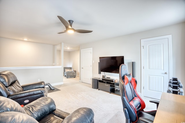 carpeted living room featuring ceiling fan