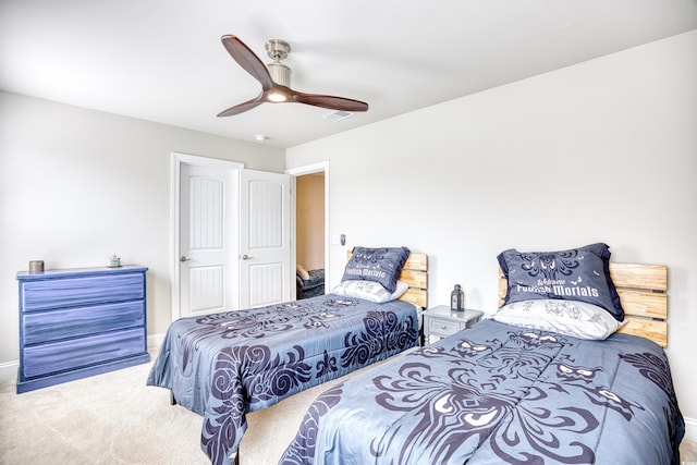 carpeted bedroom with ceiling fan