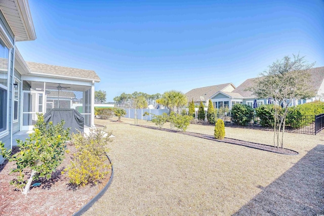 view of yard featuring a sunroom